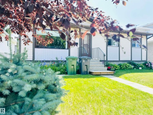 Exterior featuring light-colored siding with dark trim accents - 221 Parkview Drive, Wetaskiwin, AB - Outdoor