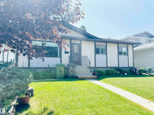 Single-story residence featuring light-colored horizontal siding and dark trim accents - 221 Parkview Drive, Wetaskiwin, AB - Outdoor