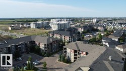 Contemporary multi-story residential buildings featuring balconies and varied exterior finishes - 