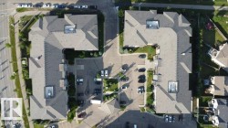Multi-building property featuring L-shaped structures with sloped roofs - 