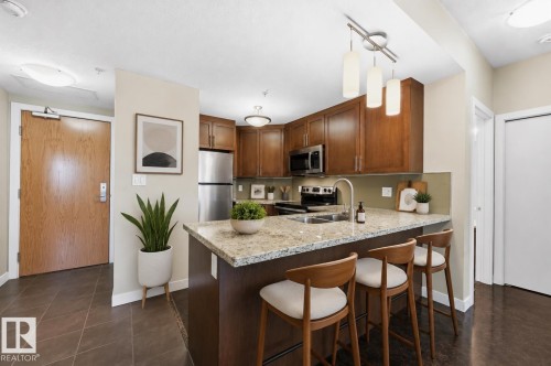 Virtually staged - #805 10055 118 St Nw, Edmonton, AB - Indoor Photo Showing Kitchen With Stainless Steel Kitchen With Double Sink