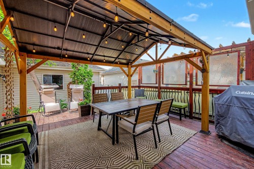 Spacious outdoor deck featuring a covered gazebo with integrated string lighting - 9130 100A Avenue Nw, Edmonton, AB - Outdoor With Deck Patio Veranda With Exterior