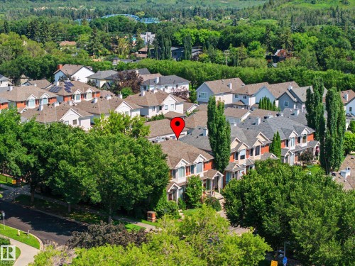Residential area featuring mature trees and multiple architectural styles including traditional and modern designs - 9130 100A Avenue Nw, Edmonton, AB - Outdoor