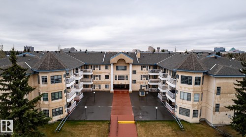 Multi-story residential complex featuring a central courtyard entrance - #310 17151 94A Av Nw, Edmonton, AB - Outdoor