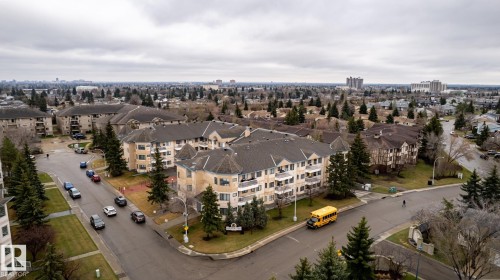 Residential neighborhood featuring multi-story buildings with balconies and varied rooflines - #310 17151 94A Av Nw, Edmonton, AB - Outdoor With View