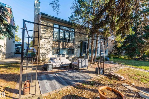 Exterior brick facade with a prominent chimney structure - 13208 128 Avenue Nw, Edmonton, AB - Outdoor
