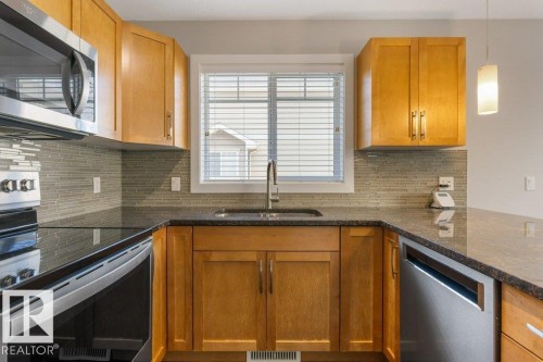 #23 7289 South Terwillegar Dr Nw, Edmonton, AB - Indoor Photo Showing Kitchen With Stainless Steel Kitchen With Double Sink