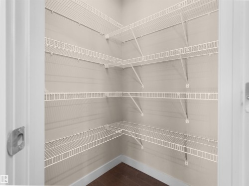 White wire shelving system providing multiple levels of storage - 4487 Annett Common Sw, Edmonton, AB - Indoor With Storage