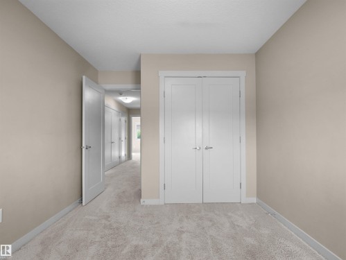 Plush carpeted flooring and neutral wall tones - 4487 Annett Common Sw, Edmonton, AB - Indoor Photo Showing Other Room