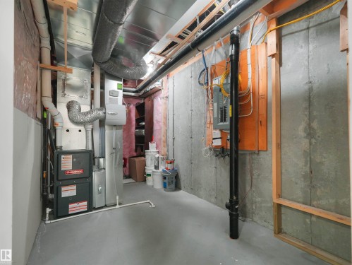 Utility room with visible furnace unit, water heater, and electrical panel - 4487 Annett Common Sw, Edmonton, AB - Indoor Photo Showing Basement