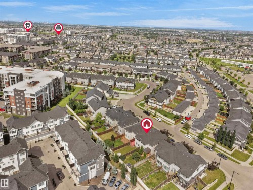 Extensive aerial view showcasing a dense residential community with varied housing types - 4487 Annett Common Sw, Edmonton, AB -  With View