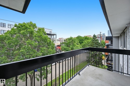 Private balcony featuring a black metal railing and concrete flooring - #433 11217 103 Av Nw, Edmonton, AB - Outdoor With Balcony With Exterior
