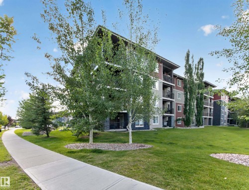Multi-story residential building with contemporary siding and stone accents - #217 12045 22 Av Sw, Edmonton, AB - Outdoor
