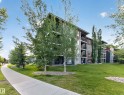 Multi-story residential building with contemporary siding and stone accents - #217 12045 22 Av Sw, Edmonton, AB  - Outdoor 