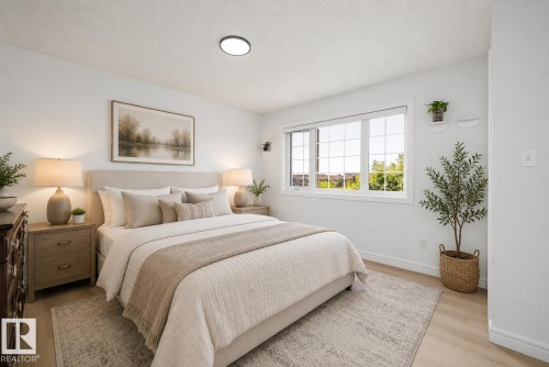 Bright room with light wood-finish flooring - 2803 12 Street Nw, Edmonton, AB - Indoor Photo Showing Bedroom