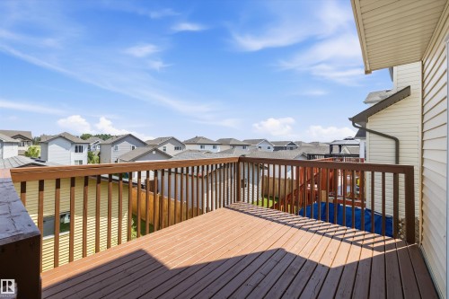Spacious outdoor deck with wood-finish decking and dark wood railings - 2803 12 Street Nw, Edmonton, AB - Outdoor With Deck Patio Veranda With Exterior