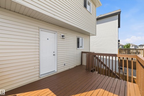 Expansive outdoor deck featuring wood flooring and matching wood railings - 2803 12 Street Nw, Edmonton, AB - Outdoor With Deck Patio Veranda With Exterior