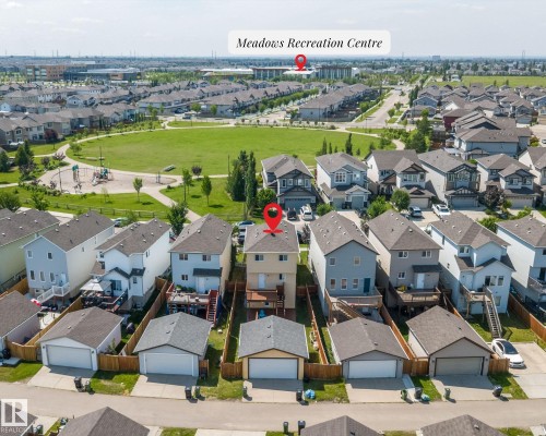 Aerial view of a residential neighborhood featuring detached homes with asphalt shingle roofs - 2803 12 Street Nw, Edmonton, AB - Outdoor With View
