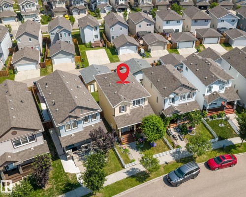 Two-story detached residence featuring a neutral-toned exterior, gabled roofline, and front porch - 2803 12 Street Nw, Edmonton, AB -  With View