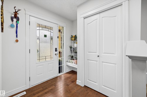 Entryway featuring wood-finish flooring and white trim - 2803 12 Street Nw, Edmonton, AB - Indoor Photo Showing Other Room