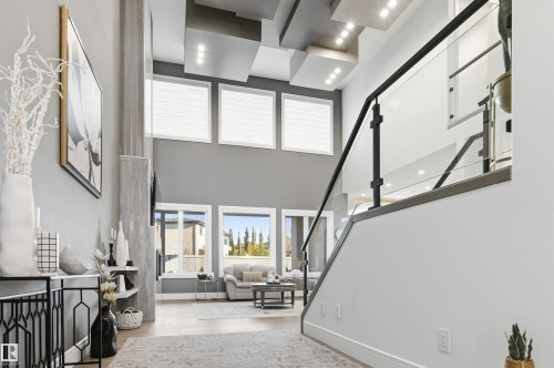 Foyer entrance featuring light wood-style floors, stairs, and a towering ceiling - 3167 Cameron Heights Way Nw, Edmonton, AB - Indoor Photo Showing Other Room