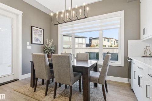 Dining room featuring light wood-style flooring and baseboards - 3167 Cameron Heights Way Nw, Edmonton, AB - Indoor Photo Showing Dining Room