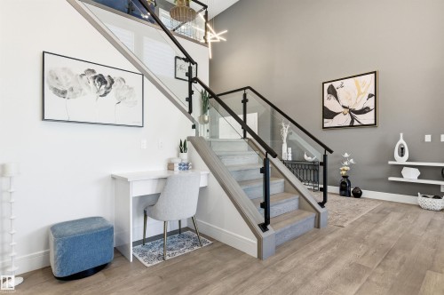 Staircase with wood finished floors and baseboards - 3167 Cameron Heights Way Nw, Edmonton, AB - Indoor Photo Showing Other Room