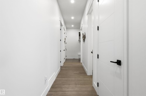 Corridor featuring recessed lighting and dark wood-style flooring - 3167 Cameron Heights Way Nw, Edmonton, AB - Indoor Photo Showing Other Room