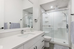 Full bath featuring vanity and a stall shower - 