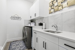 Laundry area featuring cabinet space and washer and dryer - 