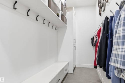 Mudroom with light tile patterned floors and baseboards - 3167 Cameron Heights Way Nw, Edmonton, AB - Indoor With Storage