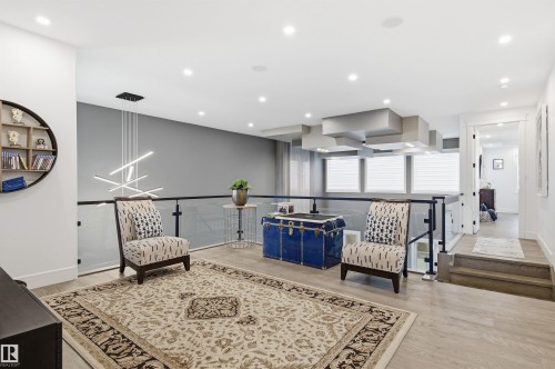 Sitting room with light wood-type flooring and recessed lighting - 3167 Cameron Heights Way Nw, Edmonton, AB - Indoor Photo Showing Other Room