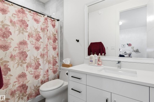Bathroom with vanity and curtained shower - 3167 Cameron Heights Way Nw, Edmonton, AB - Indoor Photo Showing Bathroom