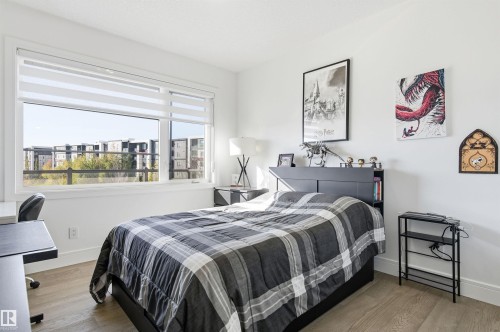 Bedroom featuring wood finished floors and baseboards - 3167 Cameron Heights Way Nw, Edmonton, AB - Indoor Photo Showing Bedroom