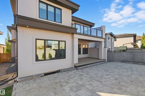 Back of property featuring a patio, stucco siding, and a balcony - 3167 Cameron Heights Way Nw, Edmonton, AB - Outdoor With Balcony With Exterior