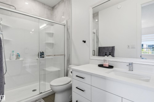 Bathroom featuring vanity and a marble finish shower - 3167 Cameron Heights Way Nw, Edmonton, AB - Indoor Photo Showing Bathroom