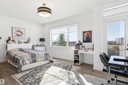Bedroom featuring an office area and wood finished floors - 3167 Cameron Heights Way Nw, Edmonton, AB - Indoor Photo Showing Bedroom