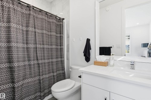 Full bath with a shower with shower curtain and vanity - 3167 Cameron Heights Way Nw, Edmonton, AB - Indoor Photo Showing Bathroom