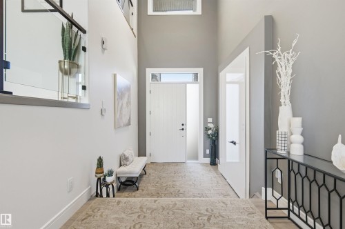 Foyer entrance with a towering ceiling and baseboards - 3167 Cameron Heights Way Nw, Edmonton, AB - Indoor Photo Showing Other Room