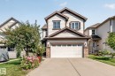 Two-story residence featuring light-colored horizontal siding and dark brown trim accents - 1115 61 Street Sw, Edmonton, AB 