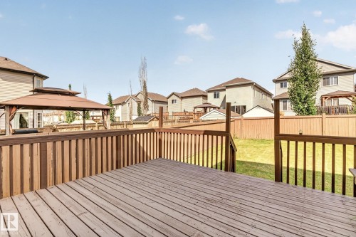 Expansive wood deck with wood plank flooring and wood railings - 1115 61 Street Sw, Edmonton, AB - Outdoor With Deck Patio Veranda