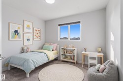 Bright room featuring a large window, neutral carpeting, and recessed lighting - 