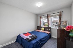 Room featuring light gray painted walls and dark carpet flooring - 