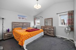 Spacious room featuring vaulted ceilings - 