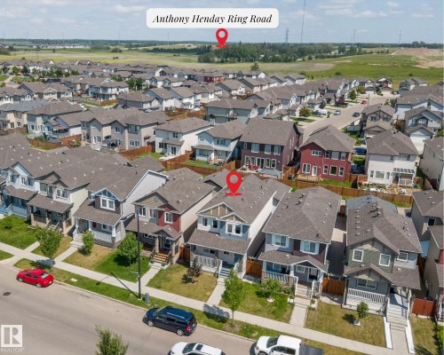 Residential neighborhood featuring detached homes with varied exterior finishes - 1563 Tamarack Boulevard Nw, Edmonton, AB - Outdoor With View