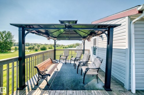 Expansive wooden deck featuring a covered gazebo - #225 3400 48 St, Stony Plain, AB - Outdoor With Deck Patio Veranda With Exterior