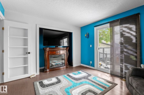 5519 10 Avenue Nw, Edmonton, AB - Indoor Photo Showing Living Room With Fireplace
