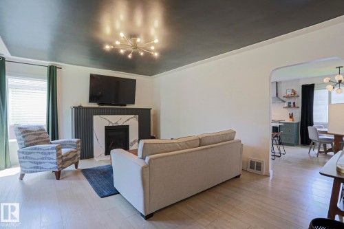 11142 51 Street Nw, Edmonton, AB - Indoor Photo Showing Living Room With Fireplace