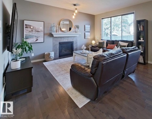 4006 Charles Place Sw, Edmonton, AB - Indoor Photo Showing Living Room With Fireplace