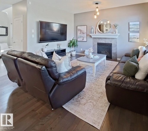 4006 Charles Place Sw, Edmonton, AB - Indoor Photo Showing Living Room With Fireplace